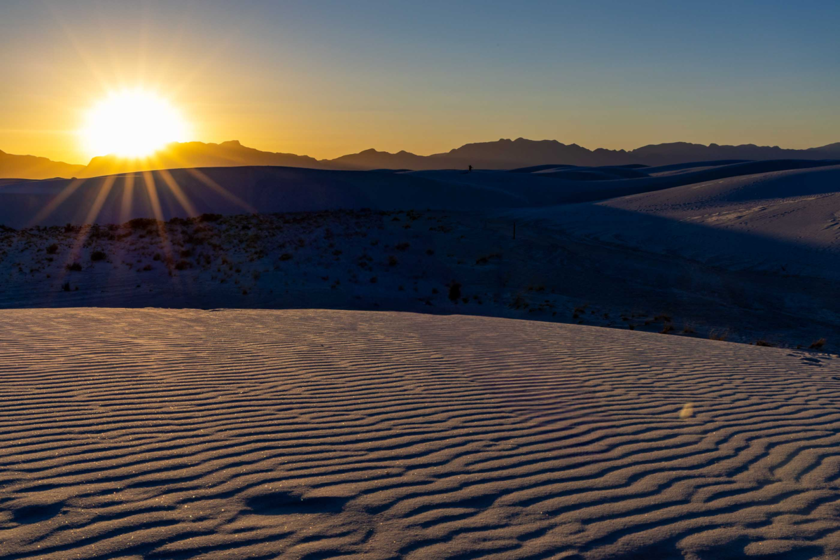 Sunset shadows on white gypsum dunes at White Sands National Park