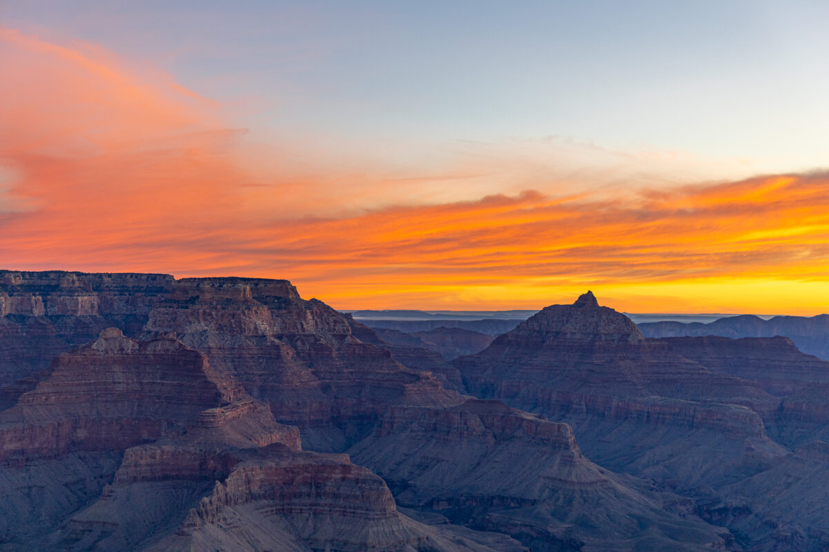 Sunrise over layered ridges in Grand Canyon National Park