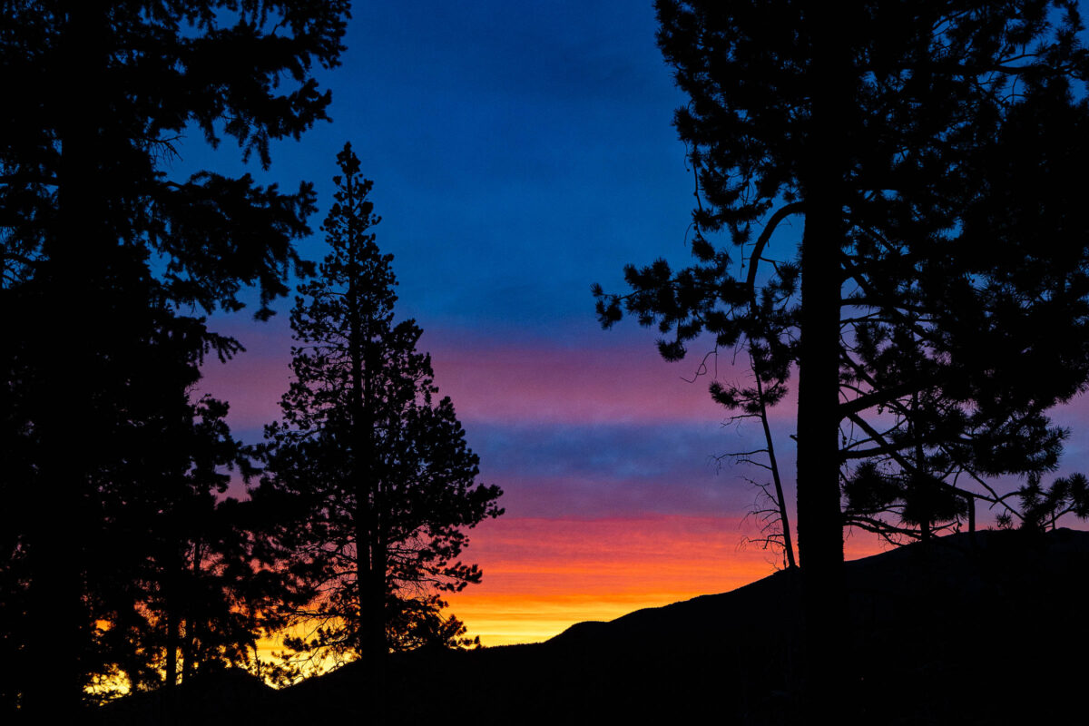 Rocky Mountain sunrise with warm light on peaks