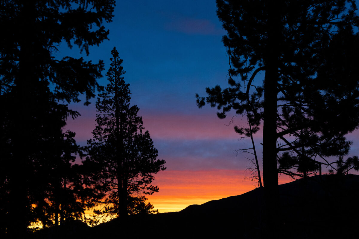 Rocky Mountain sunrise with warm light on peaks