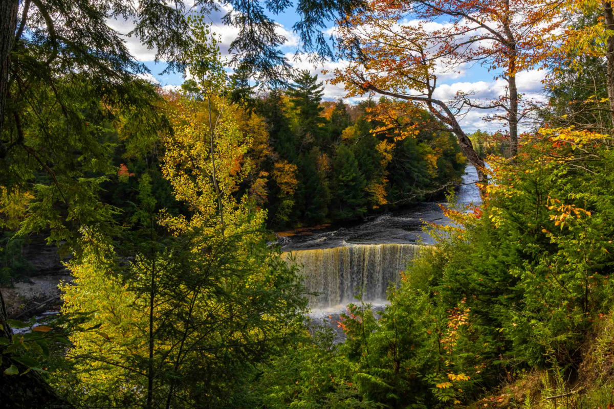 Tahquamenon Upper Falls with autumn foliage and amber water, Michigan