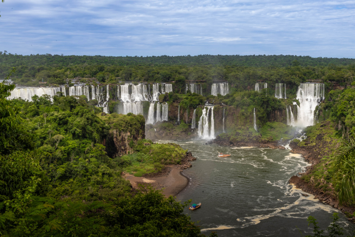 Multiple Iguazú Falls cascades flowing through rainforest cliffs on the Argentina–Brazil border