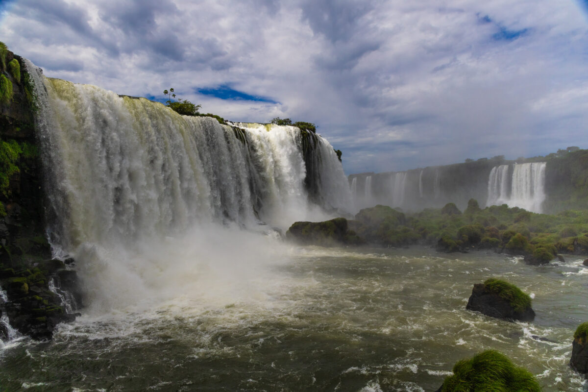 Water pouring over jungle cliffs at Iguazú Falls in Argentina and Brazil