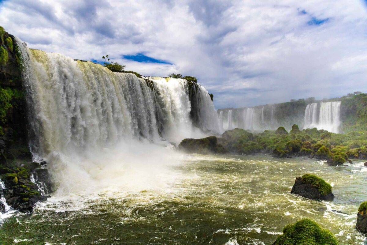 Water pouring over jungle cliffs at Iguazú Falls in Argentina and Brazil