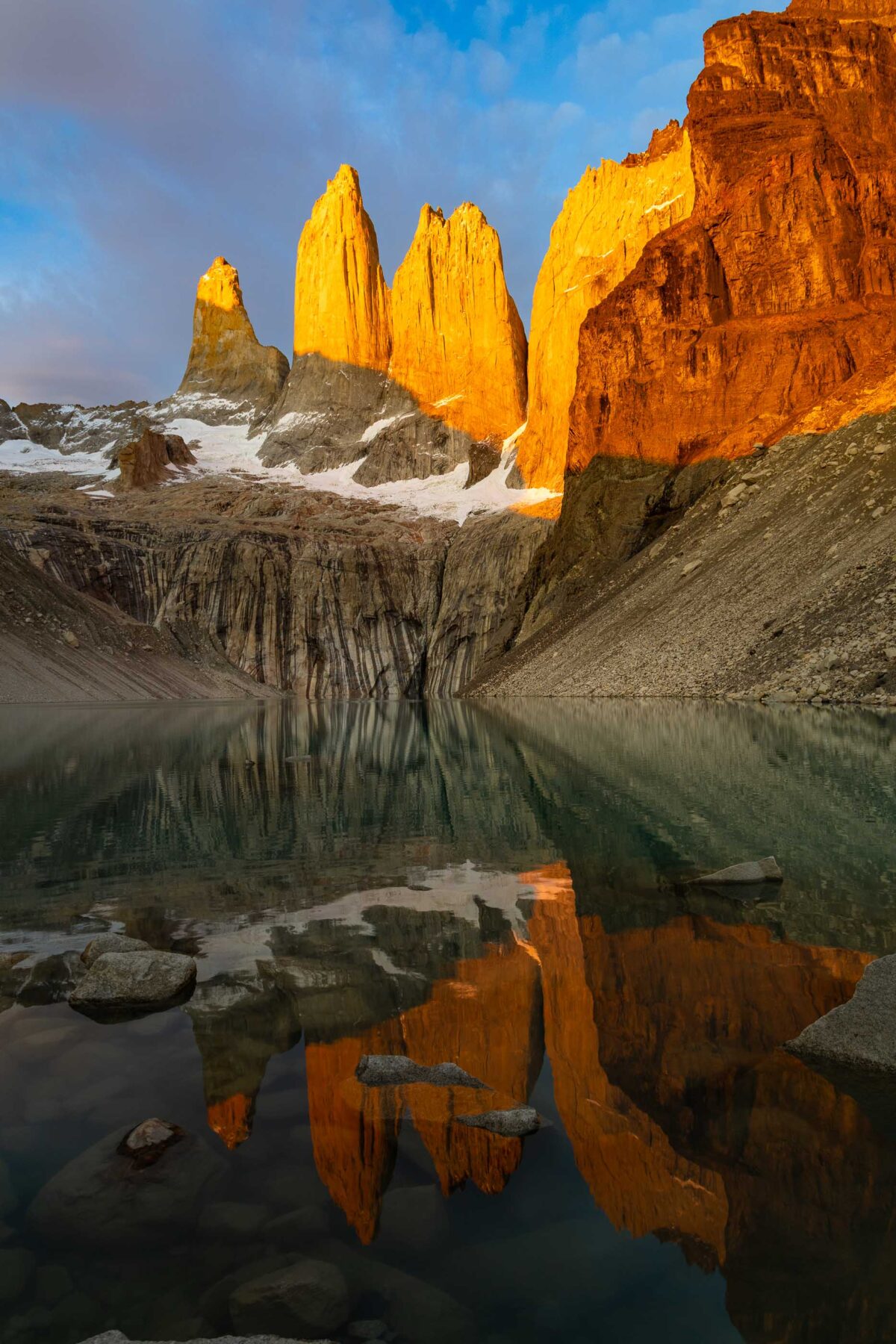 Vertical sunrise portrait of Los Torres granite towers in Torres del Paine, Chile