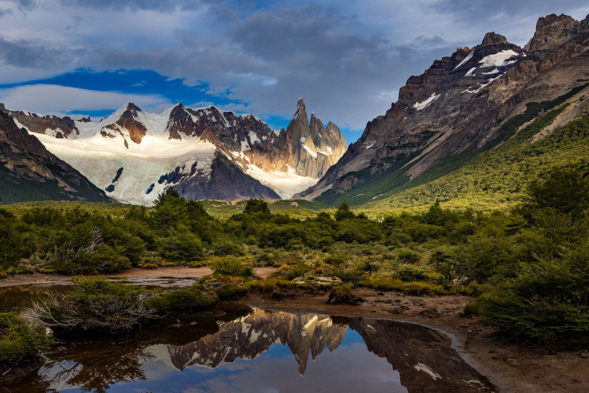 Cerro Torre reflected in still alpine water in Patagonia, Argentina