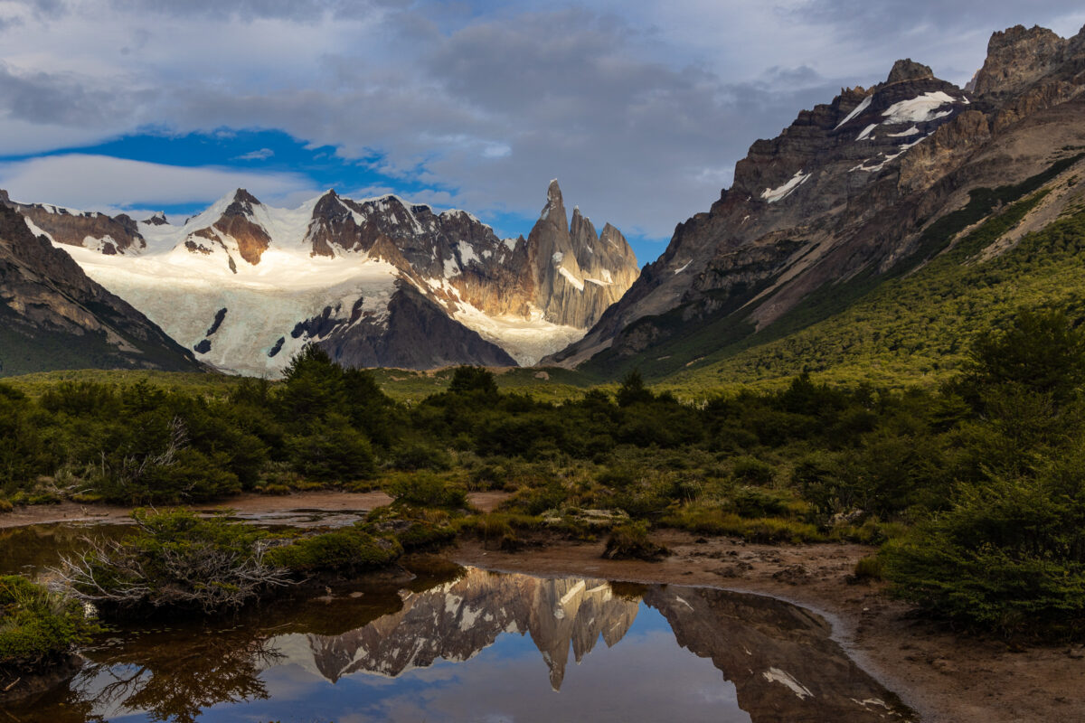 Cerro Torre reflected in still alpine water in Patagonia, Argentina
