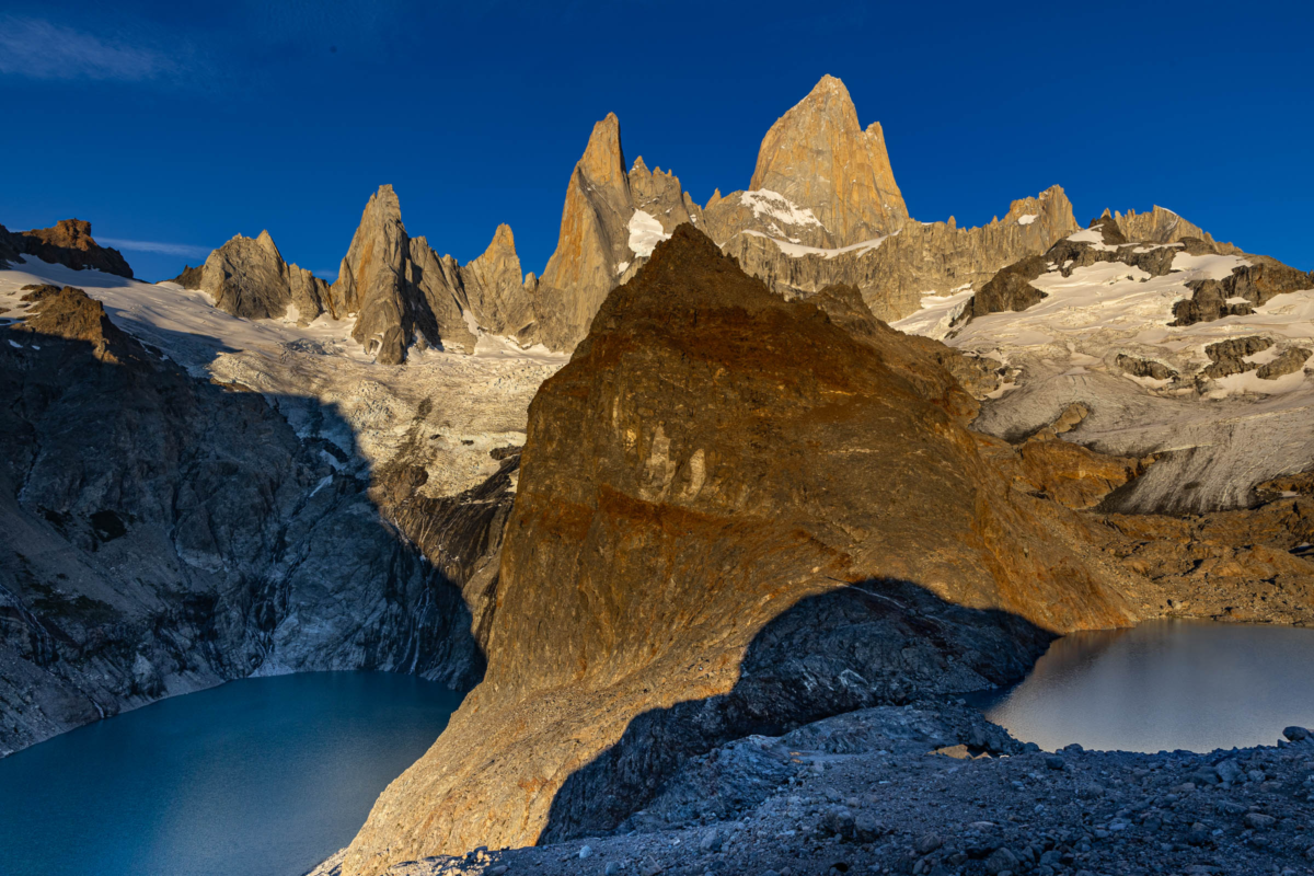 Vertical reflection of Cerro Torre mirrored in calm water in Patagonia, Argentina