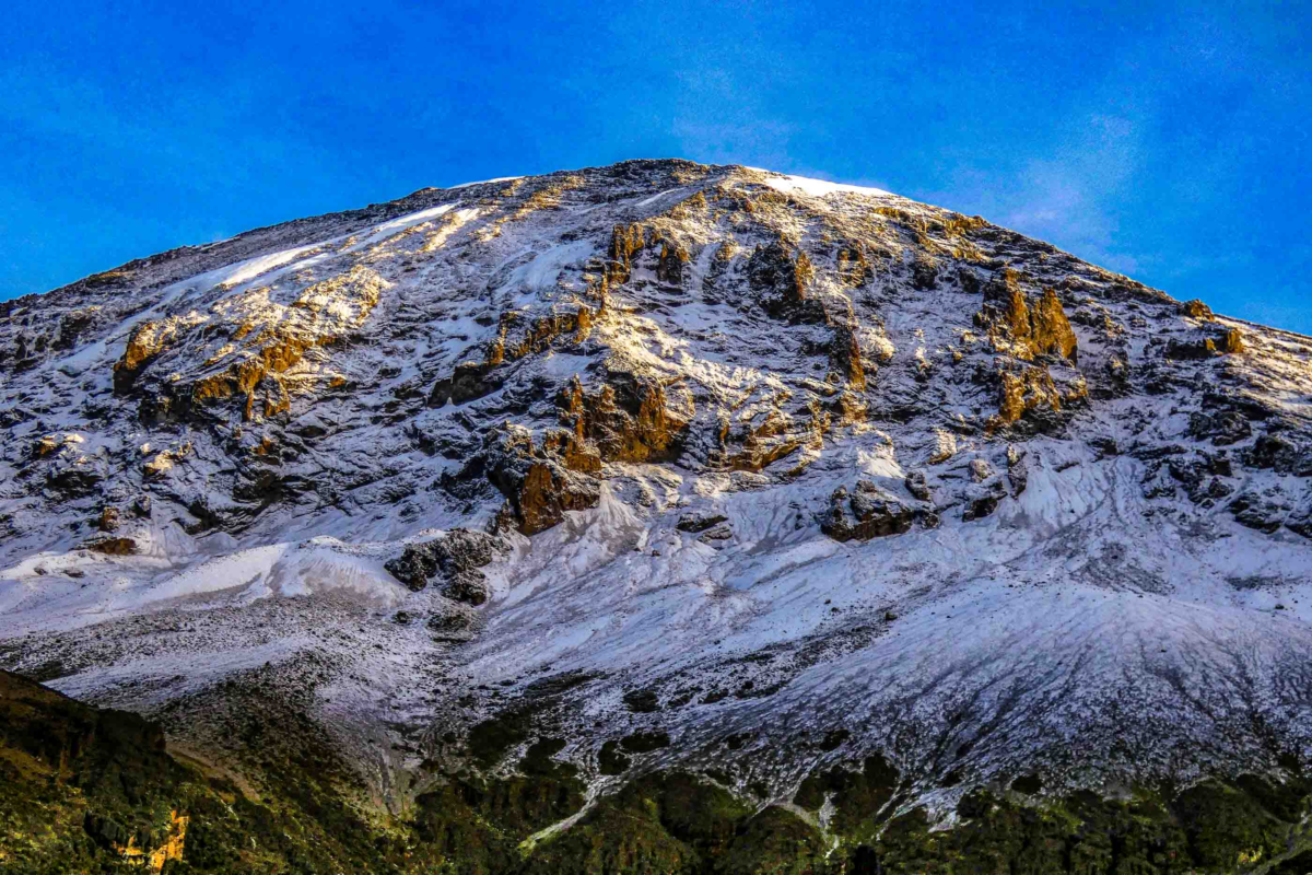 Fresh snow on Mount Kilimanjaro viewed from Karanga Camp on the Lemosho route in early morning light