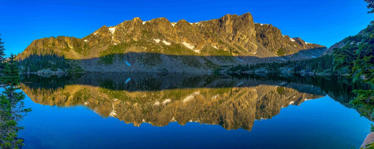 Rocky Mountain National Park's Mirror Lake reflected in early morning just after sunrise