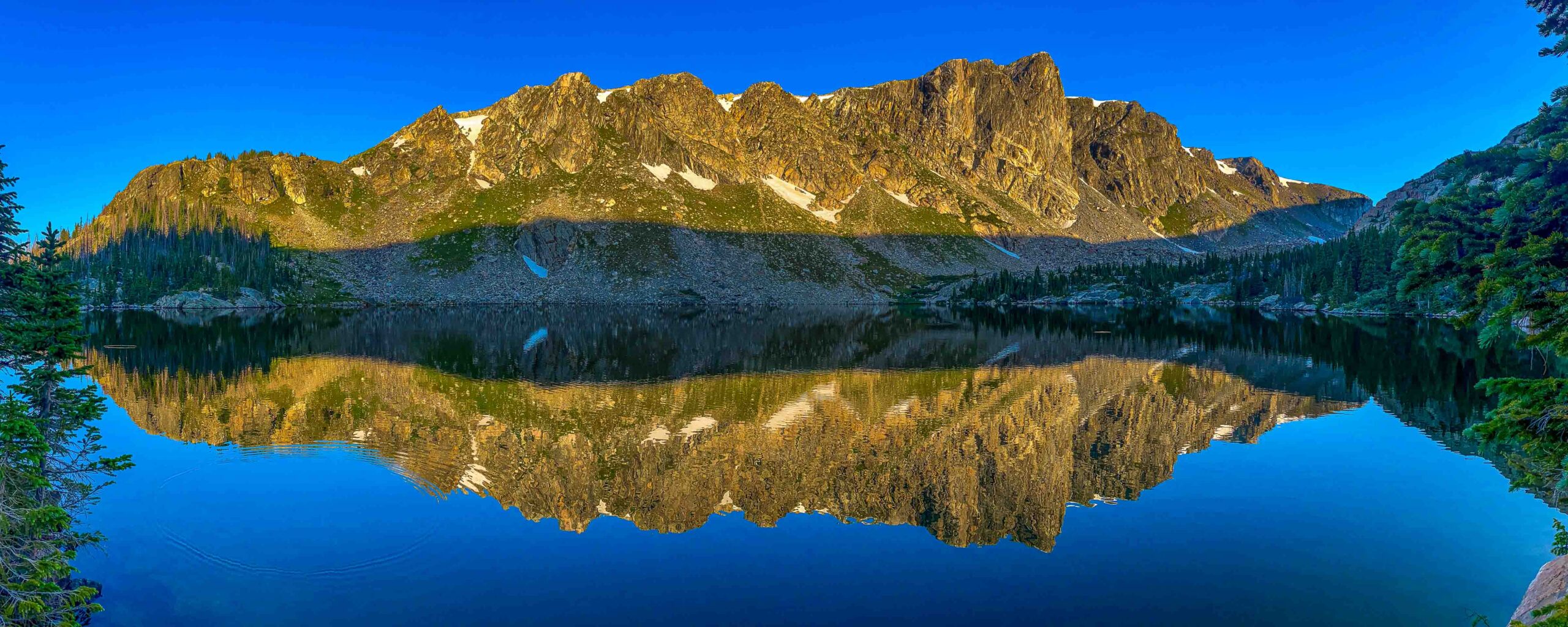 Rocky Mountain National Park's Mirror Lake reflected in early morning just after sunrise