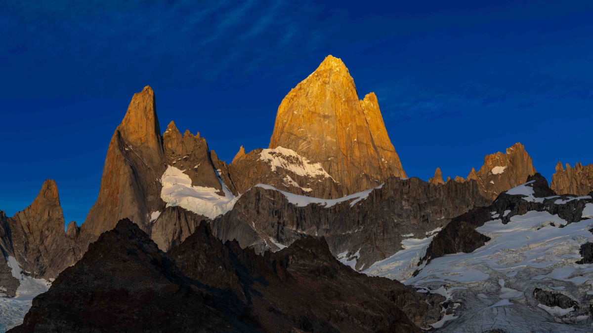 Early sunlight illuminates Mt. Fitz Roy and surrounding mountains in Argentina