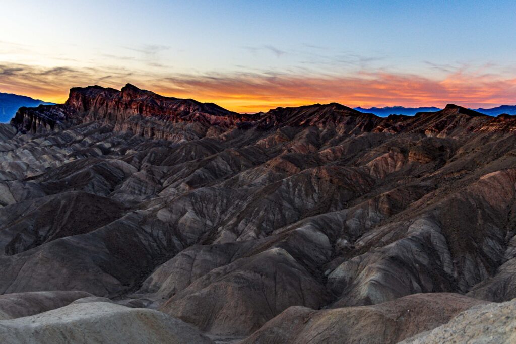 Twilight over layered badlands at Zabriskie Point in Death Valley
