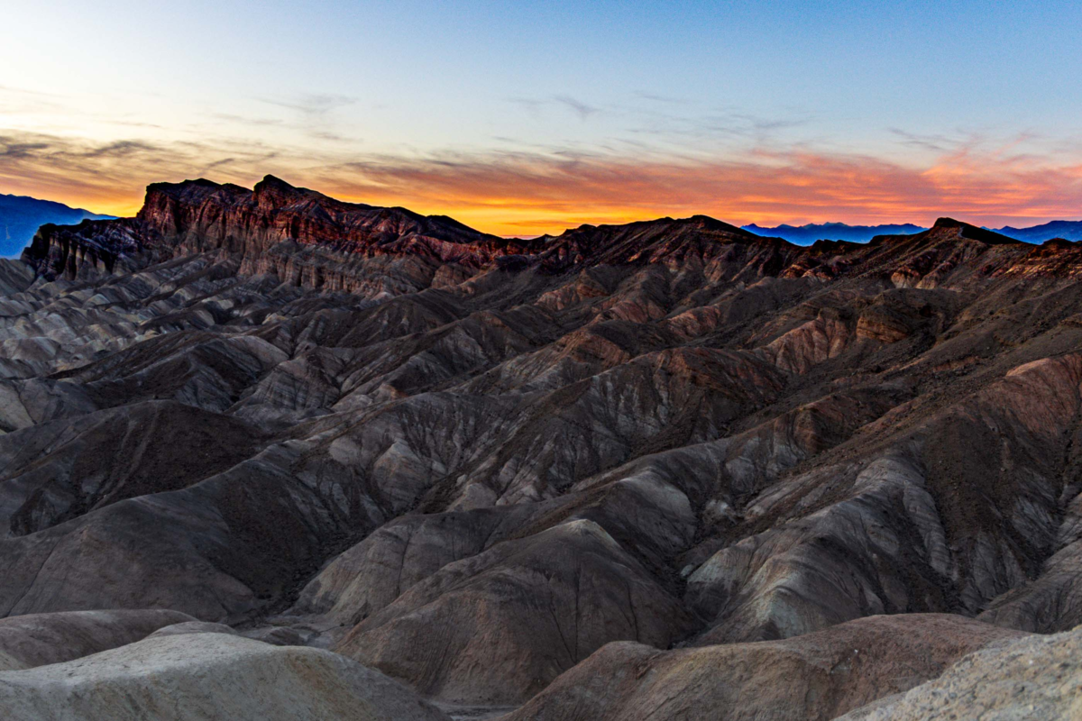 Twilight over layered badlands at Zabriskie Point in Death Valley