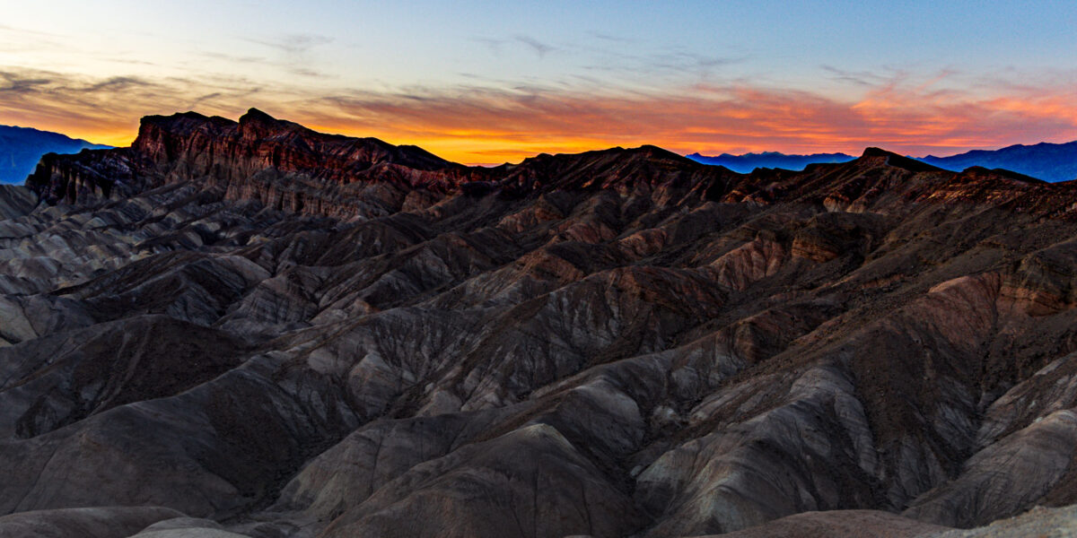 Twilight over layered badlands at Zabriskie Point in Death Valley