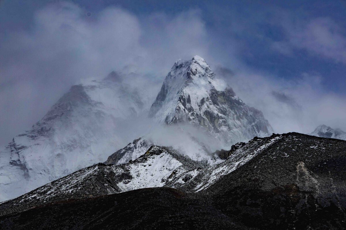 Ama Dablam mountain surrounded by storm clouds in Nepal