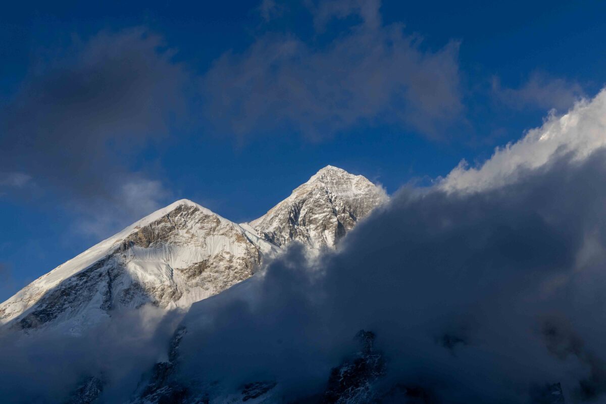 Mount Everest rising above clouds in the Himalaya of Nepal