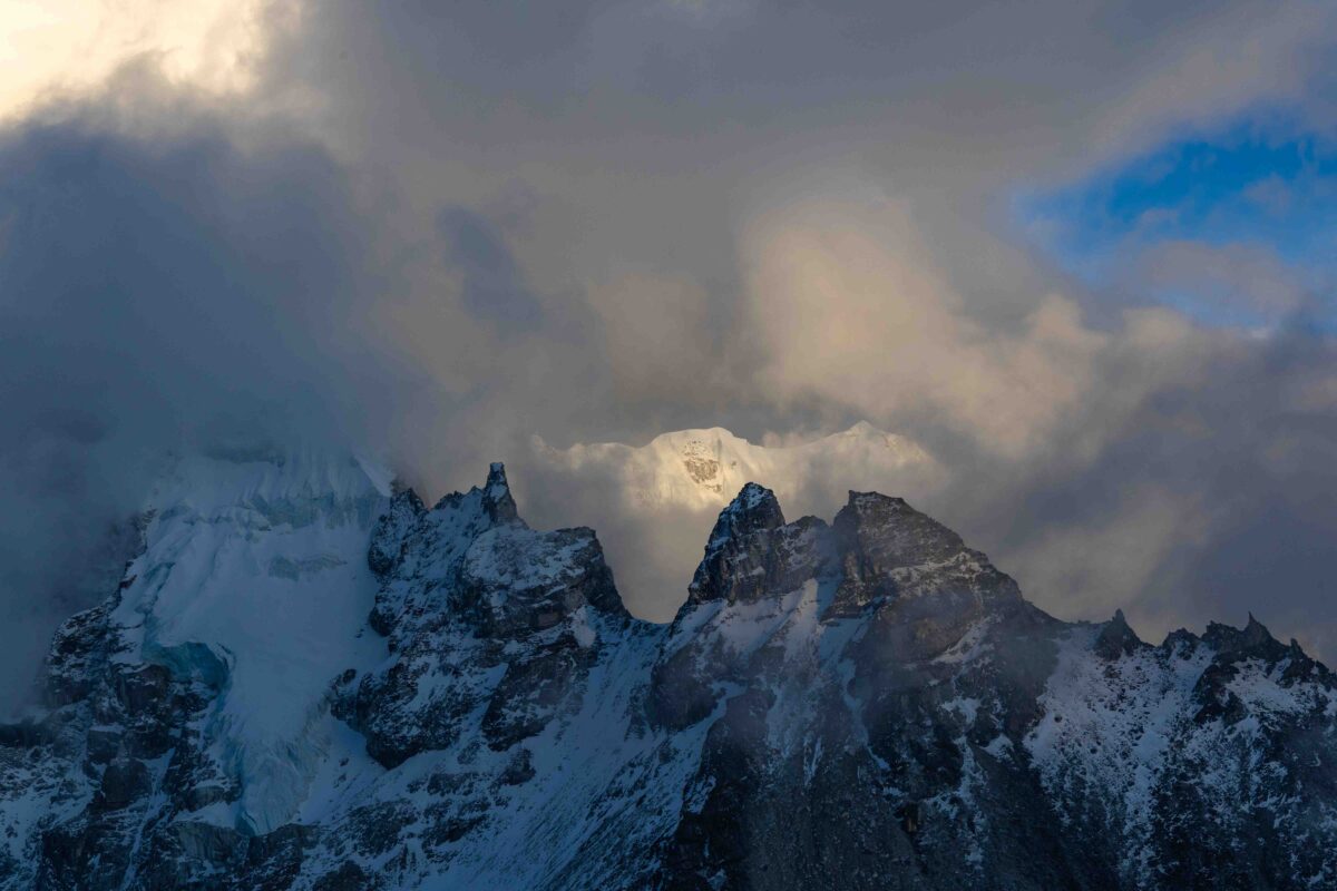 Storm clouds and illuminated Himalayan peaks in Nepal