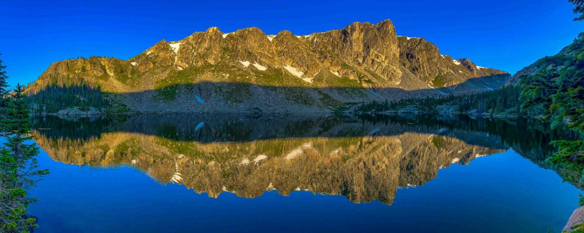Rocky Mountain National Park's Mirror Lake reflected in early morning