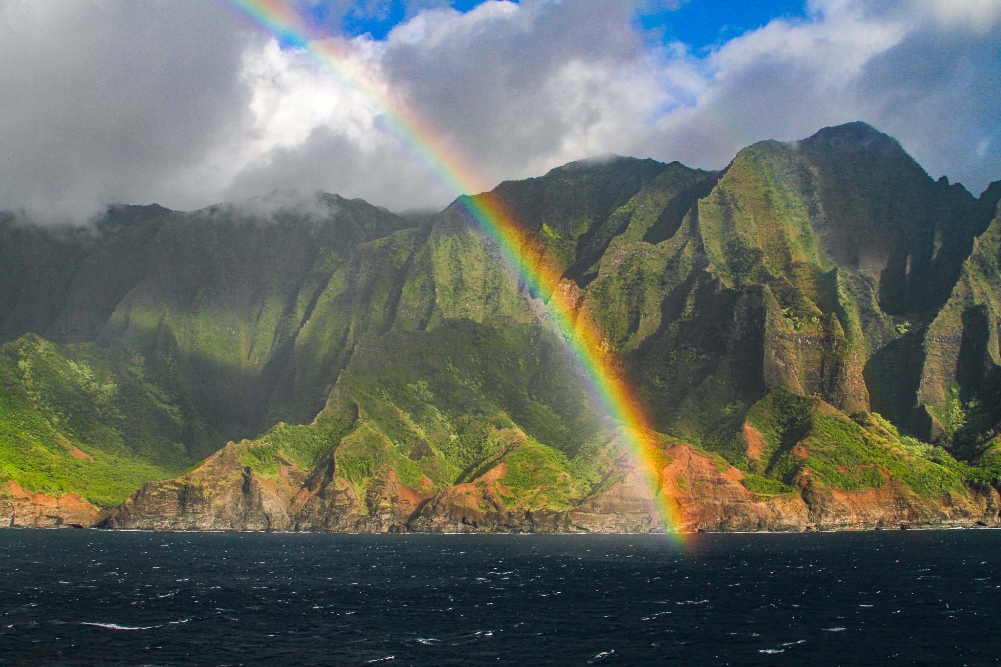 Colorful rainbow off the Napoli Coast in Kauai