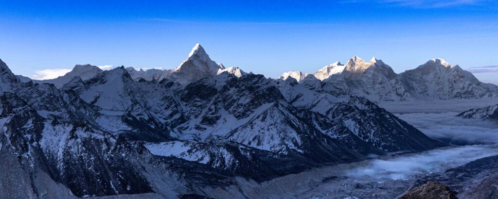 Panoramic fine art landscape photograph of Ama Dablam illuminated by sunrise in Nepal's Khumbu region, selected for the Large Wall Art collection.
