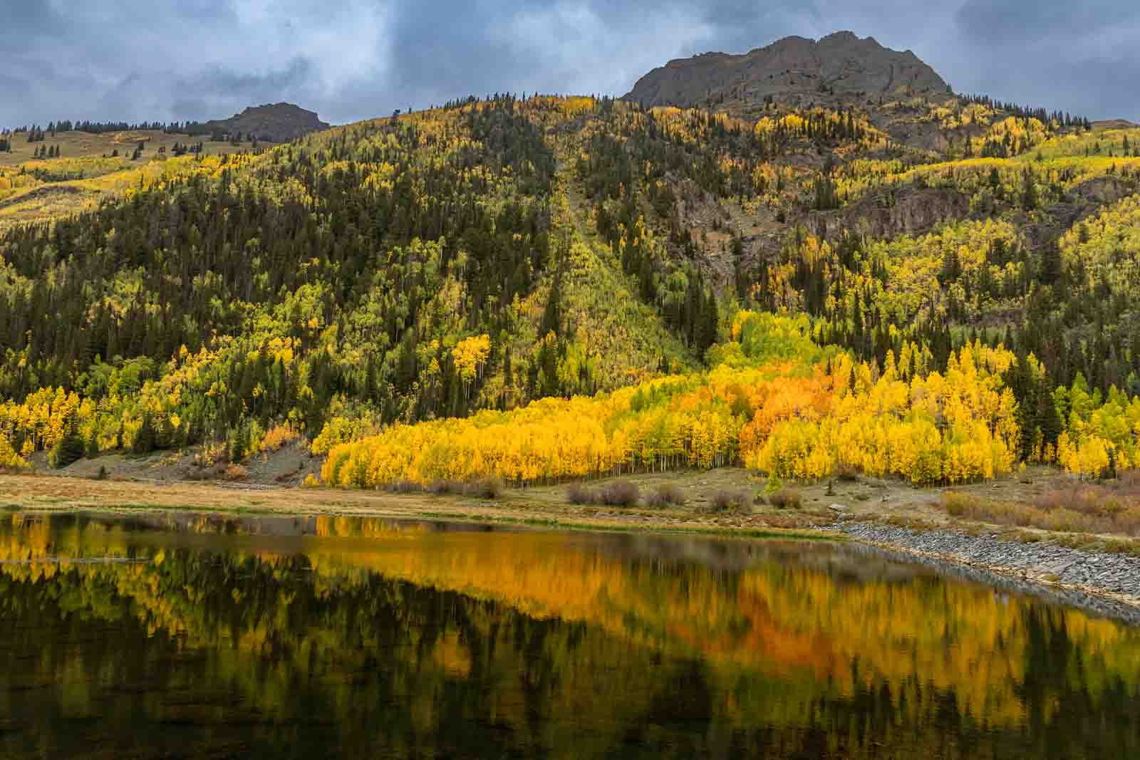Golden aspens and mountains reflected in Crystal Lake, Colorado