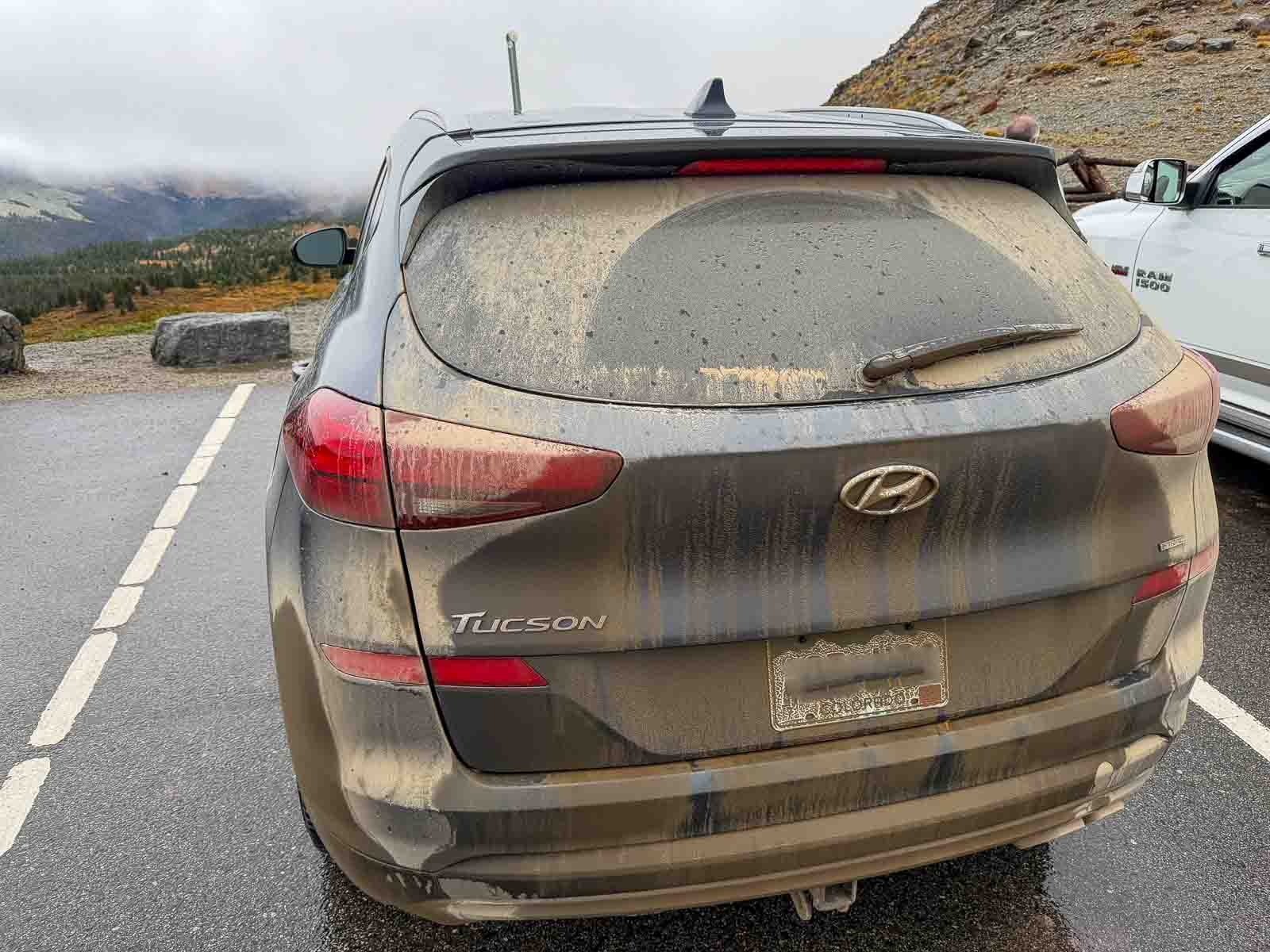 Our car covered in dirt after the Colorado fall colors road trip