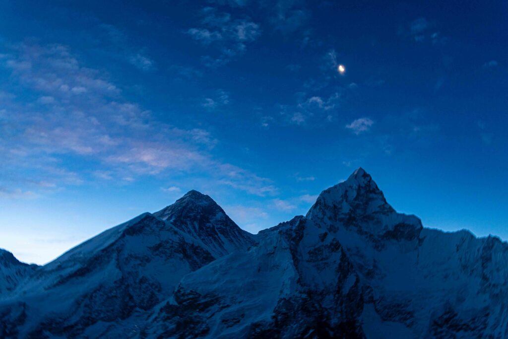 Moon rising over Everest & Nuptse as a Hint of Dawn Appears
