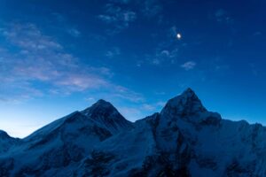 Moon rising over Everest & Nuptse as a Hint of Dawn Appears