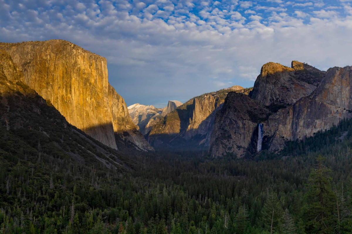 Golden evening light on El Capitan above Yosemite Valley with Half Dome and Bridalveil Fall