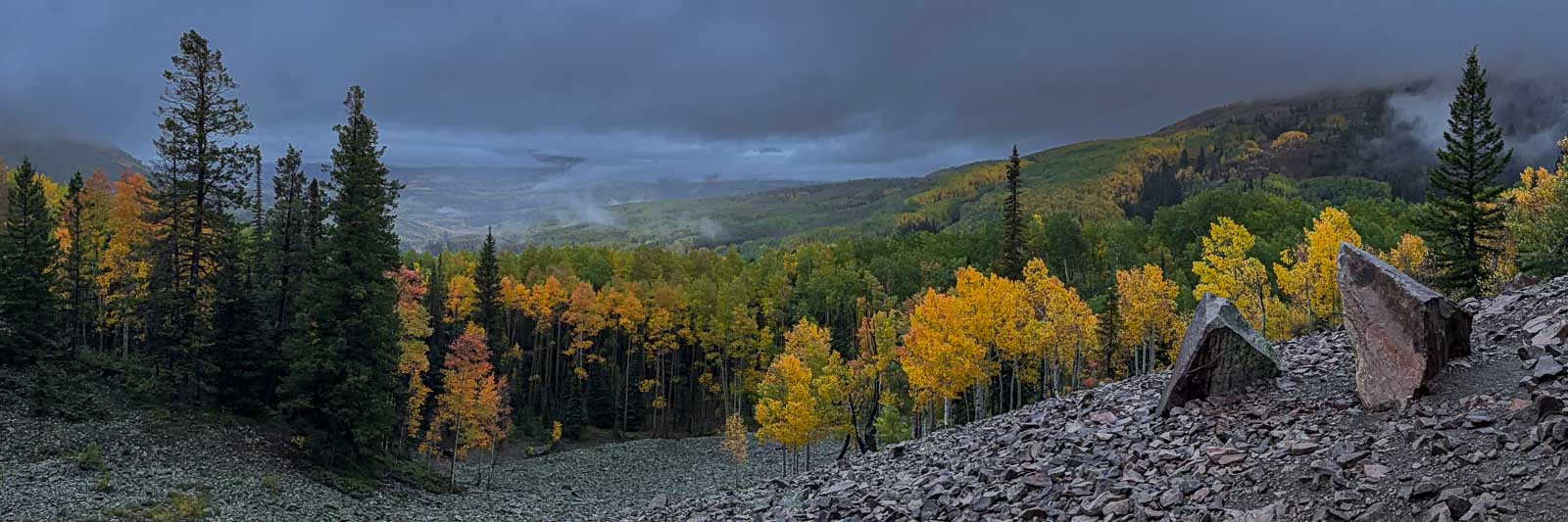 Panoramic view of autumn aspens and mountains at Ohio Pass, Colorado